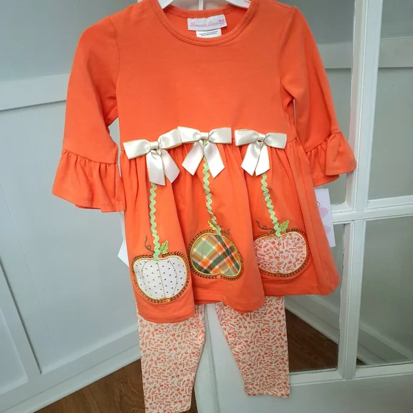 Bonnie Jean Orange Pumpkin Tunic with Cream Bows & Printed Leggings - Picture 1 of 9